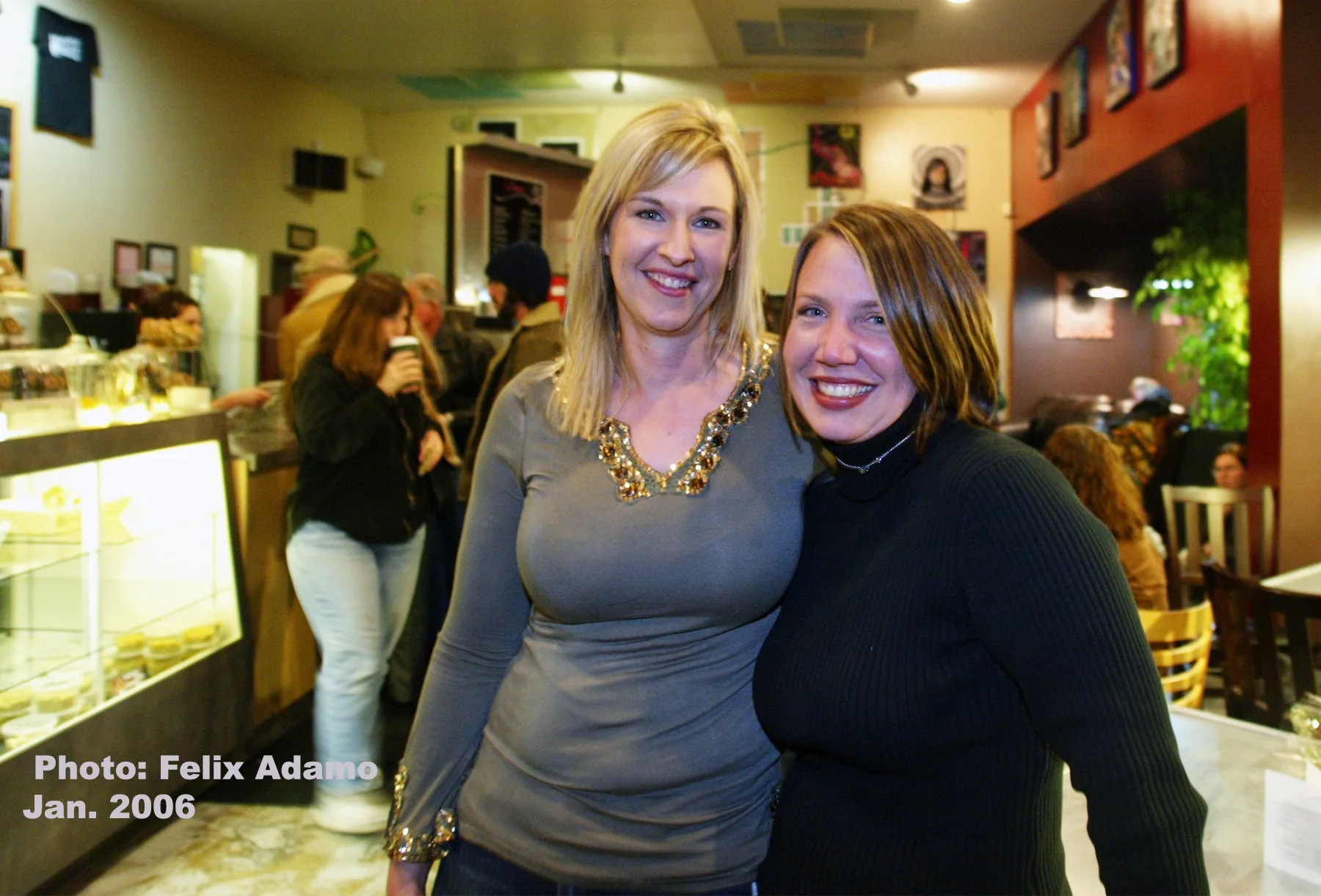 Two customers smiling inside Dagny's in 2006