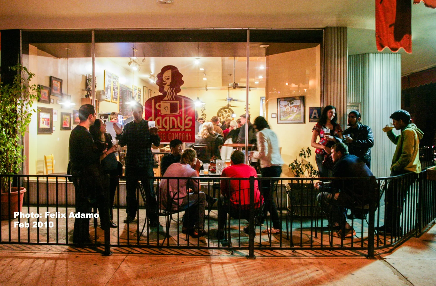 A crowded Dagny's patio and interior gathering in 2010